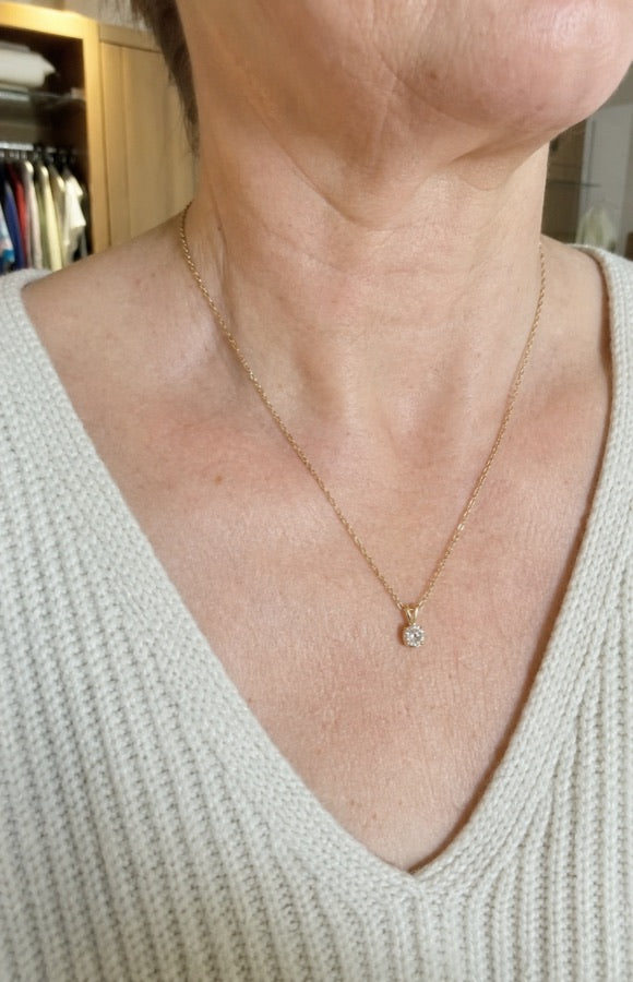 Denise wearing her Alvonie necklace at home